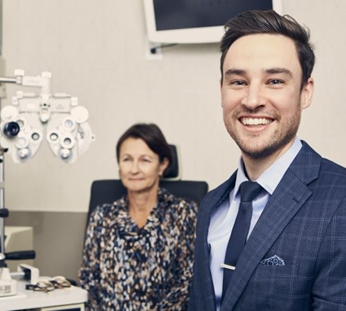 Eye care professional examining a patient in a modern clinic